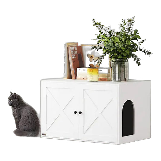 White barn door litter box enclosure styled as a side table with cat sitting beside it