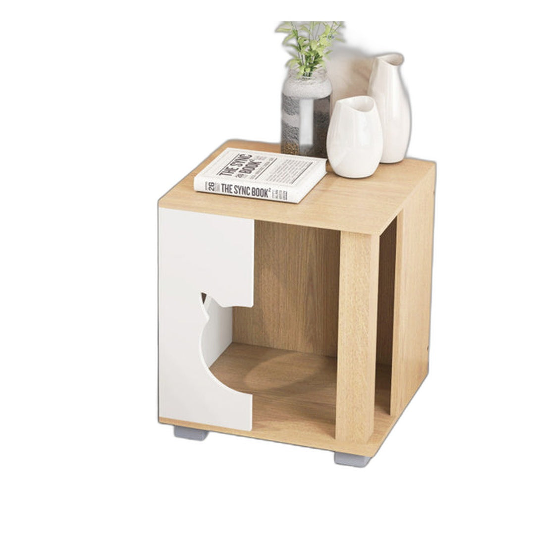 Cat house nightstand styled with vases and books