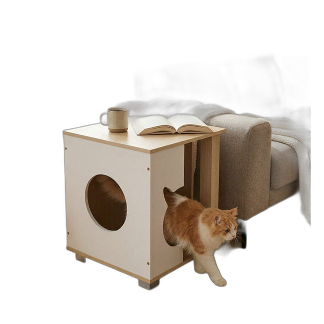 Cat stepping out of the nightstand hideaway